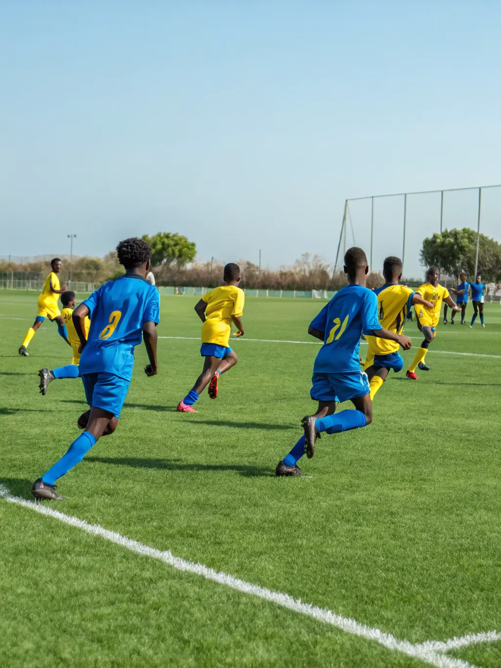 A photo of a sports team sponsored by AMICALE LAIQUE SAINTES, highlighting youth development and physical activity.